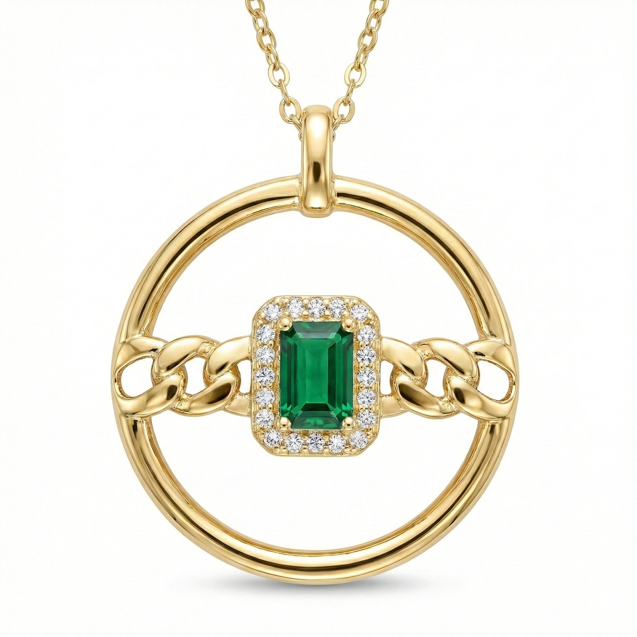 Gold pendant with a green gemstone and chain design on a white background