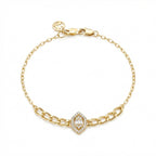 Gold bracelet with a decorative clasp on a white background