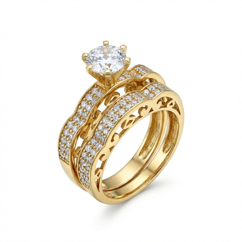 Gold ring with diamond accents on a white background