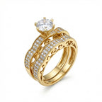 Gold ring with diamond accents on a white background