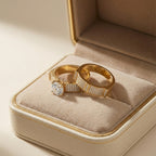 Two gold rings with diamonds in a jewelry box
