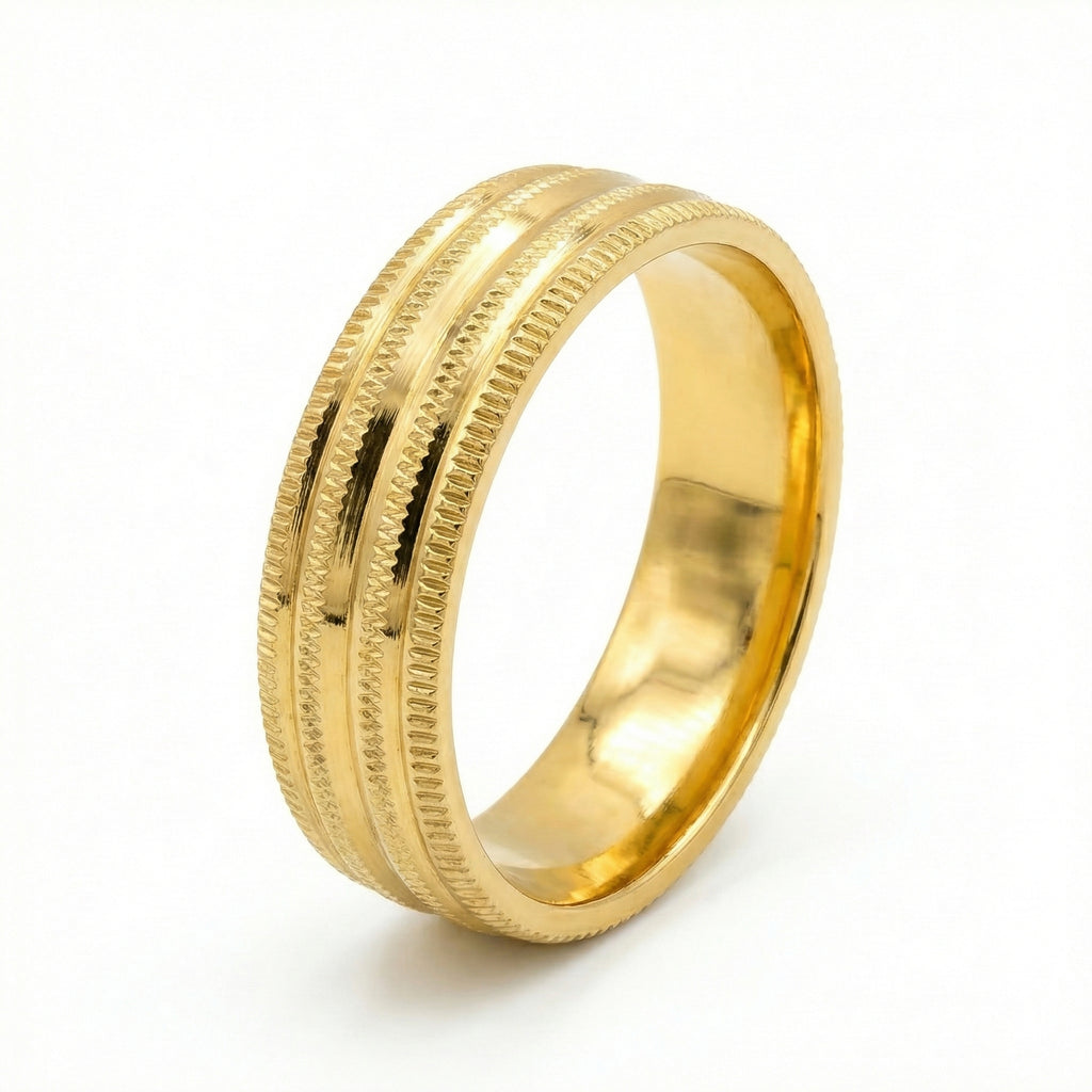 Gold ring with textured design on a white background