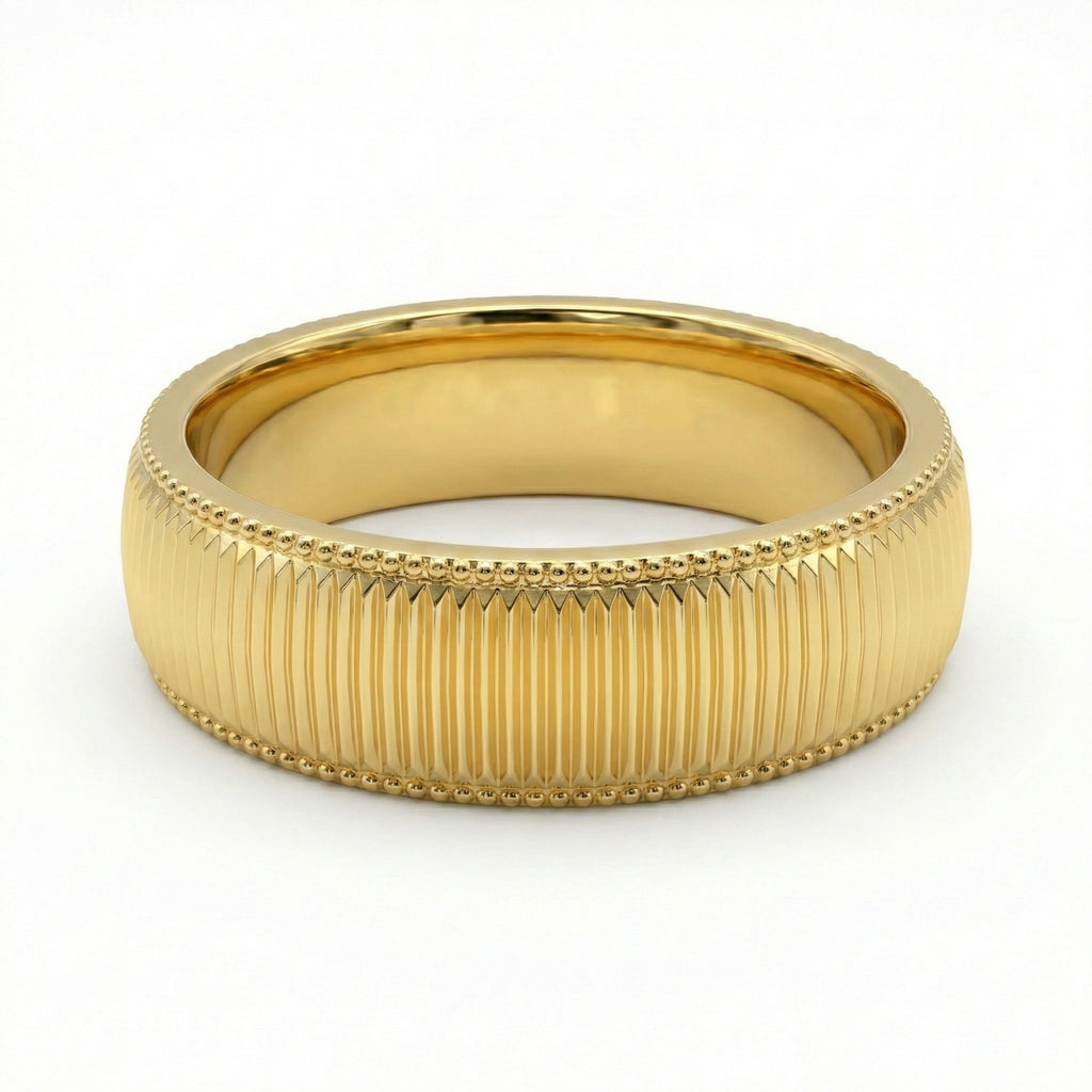 Gold ring with textured band on a white background