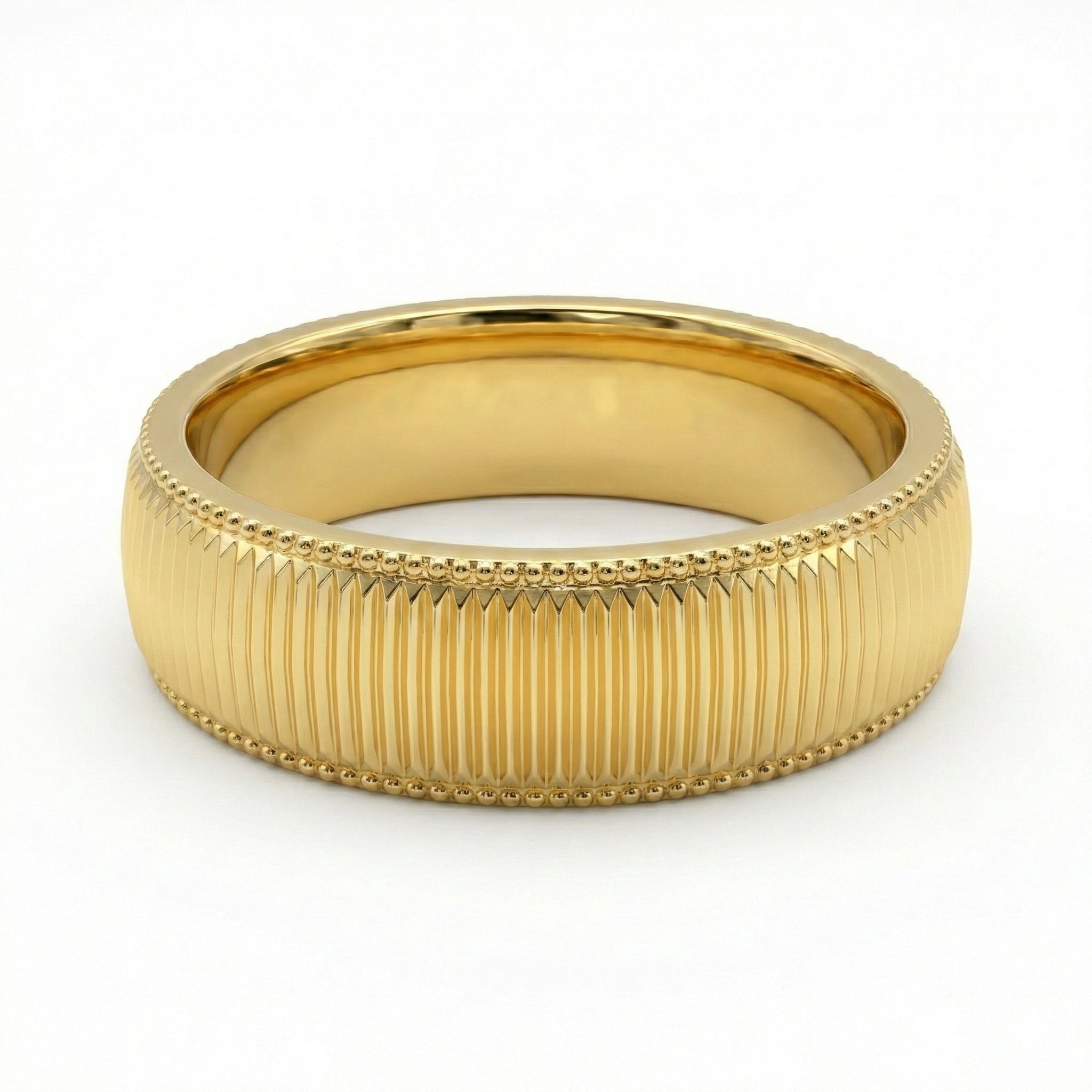 Gold ring with textured band on a white background