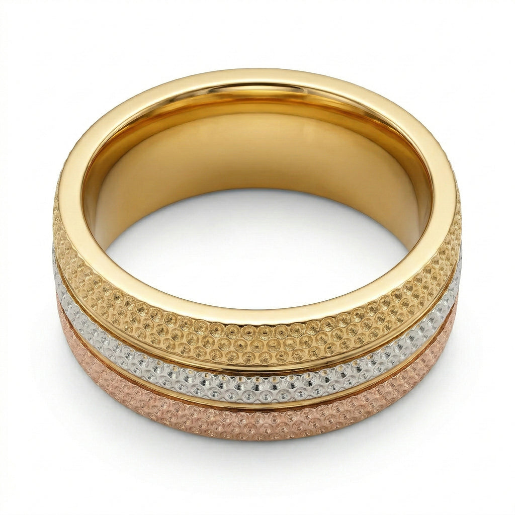 Gold ring with textured design on a white background