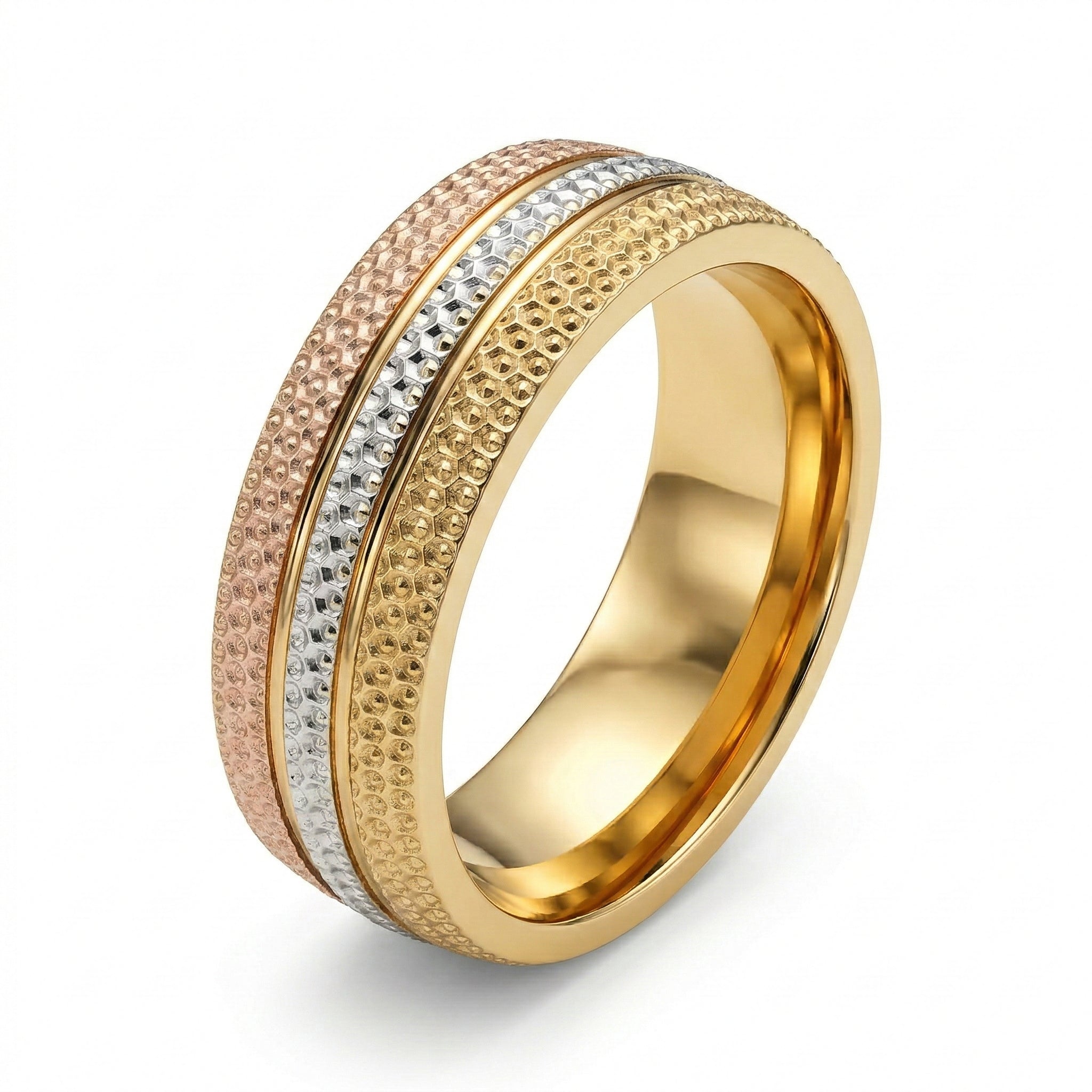 Gold, rose gold, and silver ring on a white background