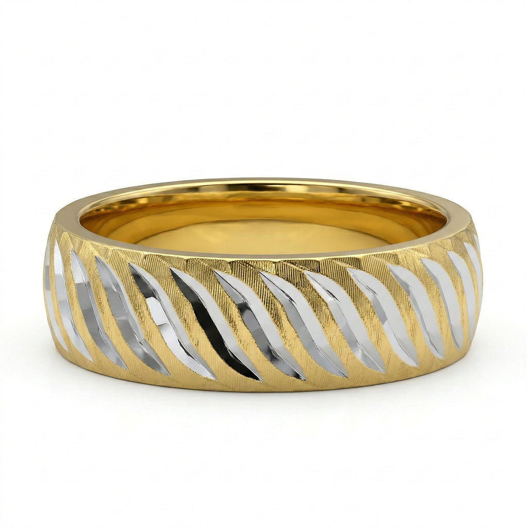 Gold and silver ring with wavy pattern on a white background
