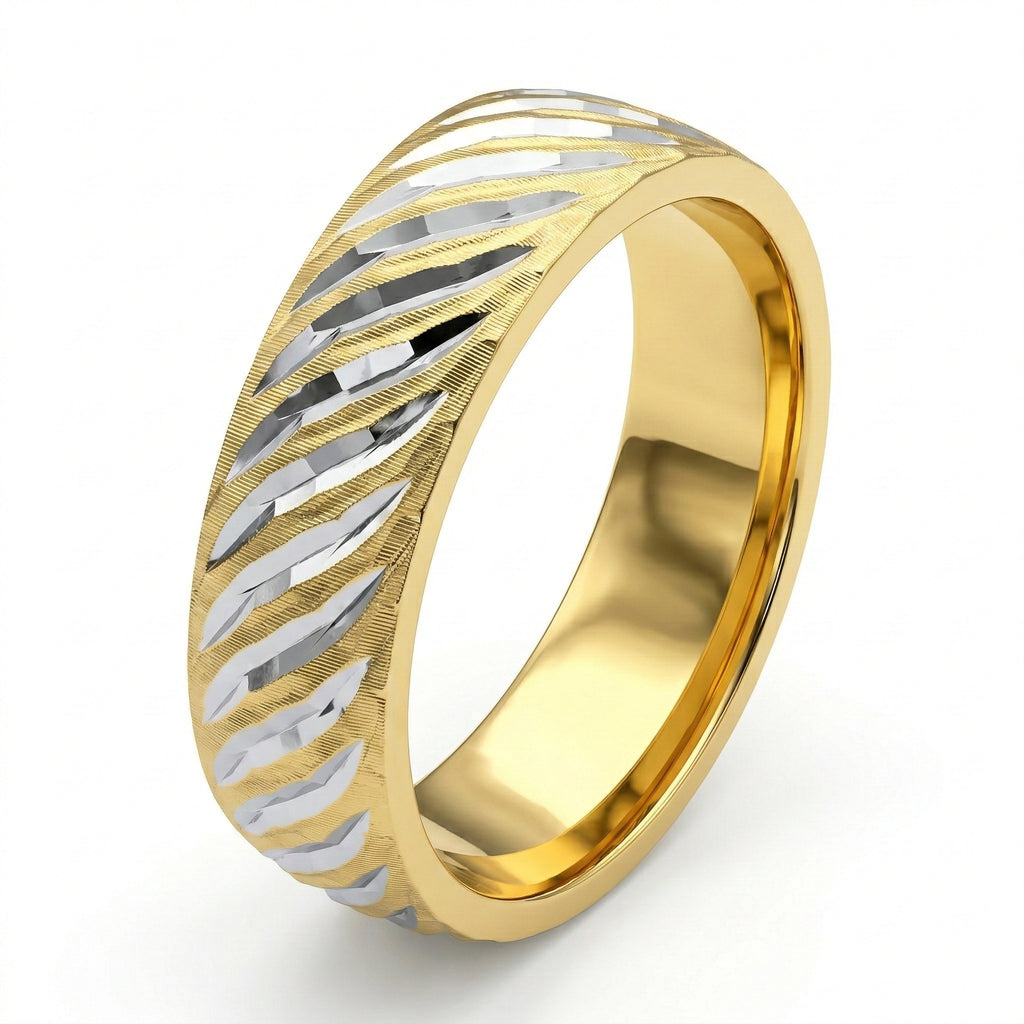 Gold and silver ring with a geometric pattern on a white background