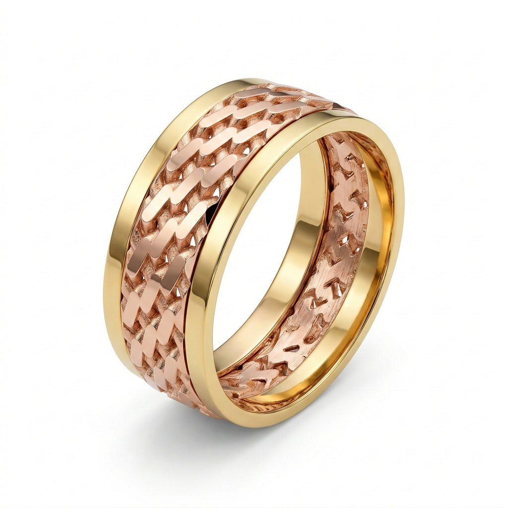 Gold and rose gold ring with textured design on a white background
