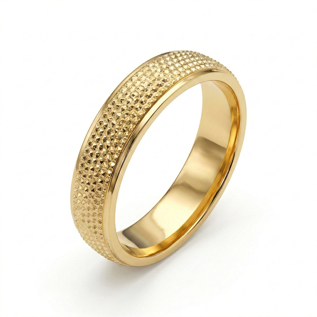 Gold ring with textured design on a white background