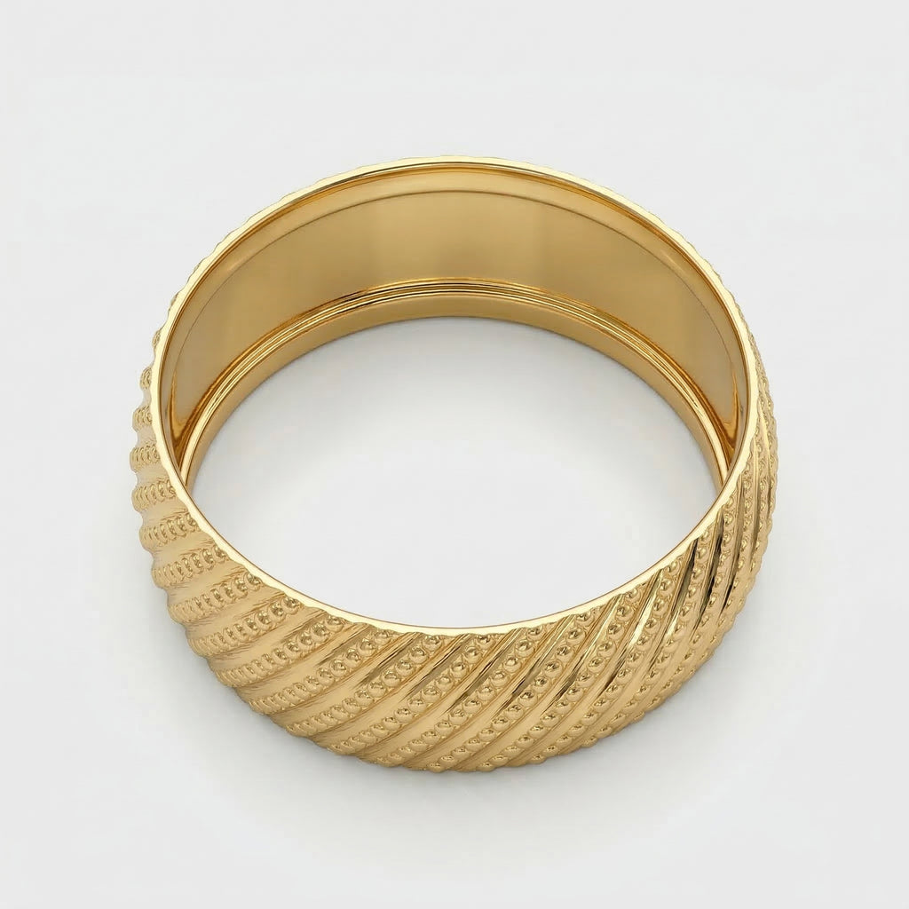 Alyans 18k yellow gold wedding band ring from The Forever Edit collection, featuring an intricate diagonal textured pattern with polished edges, displayed on a pure white background.