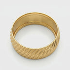 Alyans 18k yellow gold wedding band ring from The Forever Edit collection, featuring an intricate diagonal textured pattern with polished edges, displayed on a pure white background.